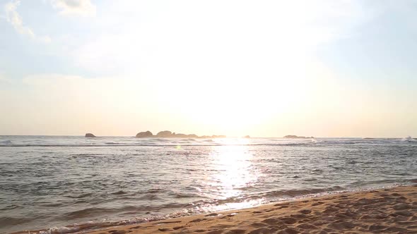 Ocean View In Hikkaduwa In Sunset With Waves Splashing The Beach. 1