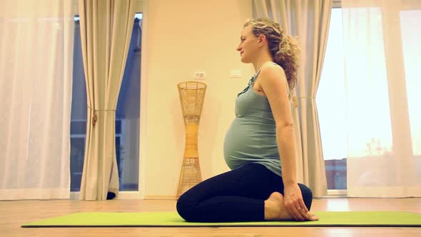 Pregnant Woman Practicing Yoga
