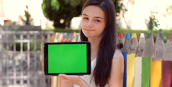 Student Girl Shows Tablet Pc at Camera