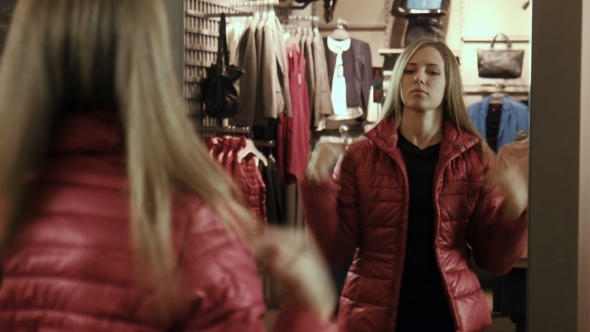 The Girl Tries On a Red Jacket