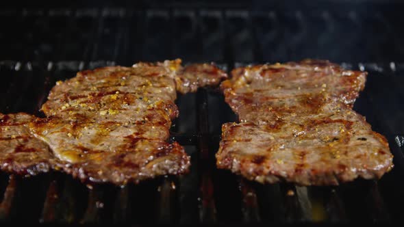 Flipping Juicy Rib Eye Steaks On Grill 05