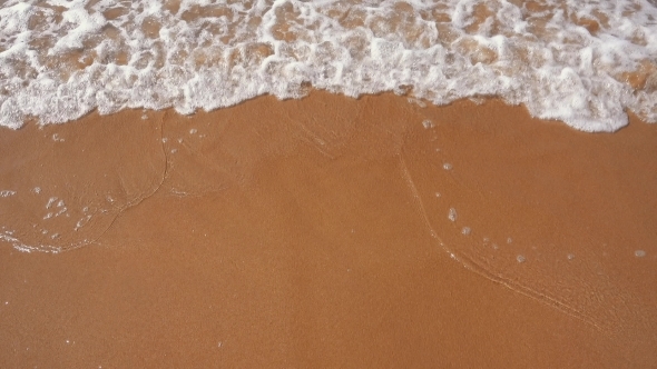 Ocean Waves Incoming On Sand Beach