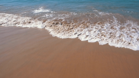 Ocean Waves Incoming On Sand Beach