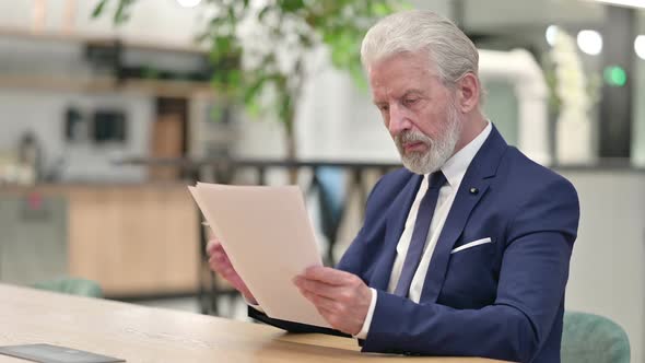 Senior Old Businessman Reading Documents