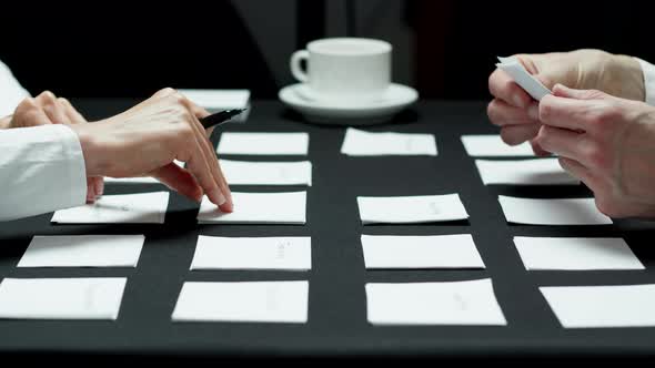 Hands of business people writing down ideas and planning the development of the project.