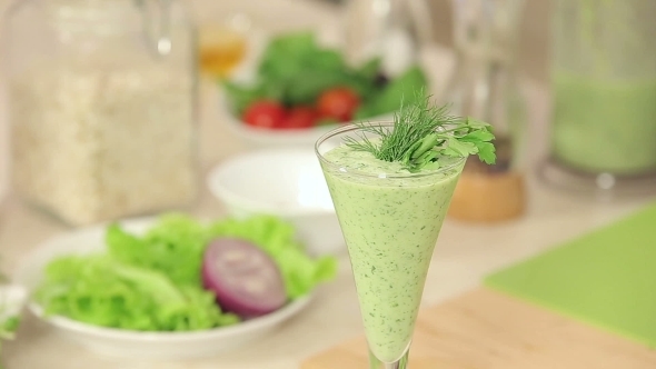 Chef Is Decorating a Glass Of Green Vegetable