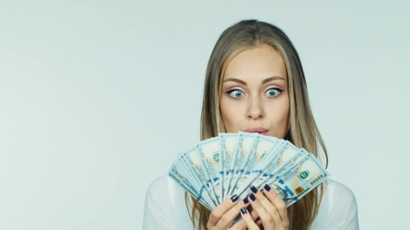 An Attractive Woman With a Fan Of Dollars