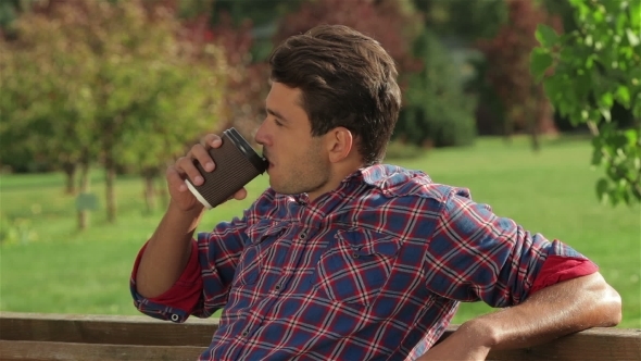 Portrait Of a Male Drinking Coffee Outdoors