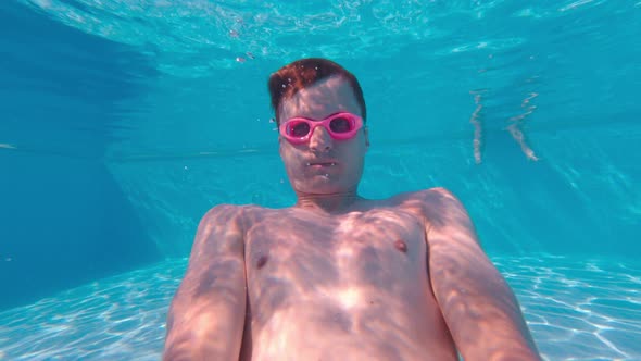 Man Underwater In The Pool Selfie