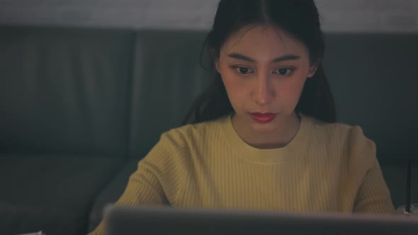 Stressed Woman Working on Laptop