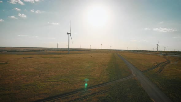 Aerial View of Wind Turbine on a Field in a Summer Day. Environment Friendly and Renewable Energy