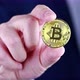 Businessman holds Bitcoin in his hand. - VideoHive Item for Sale