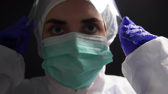 Doctor in Protective Wear, Medical Mask and Gloves