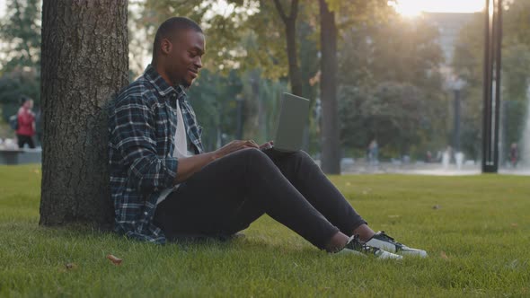 Young African American Man Guy Student Male Freelancer Worker User with Laptop Working Typing