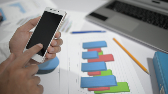Man Using Smartphone at Work alt