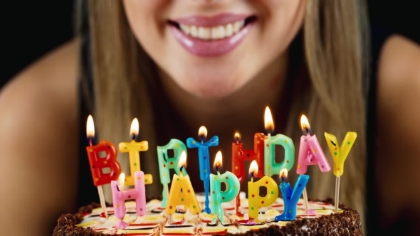 Girl Blows Out The Candles On The Cake, Smiles