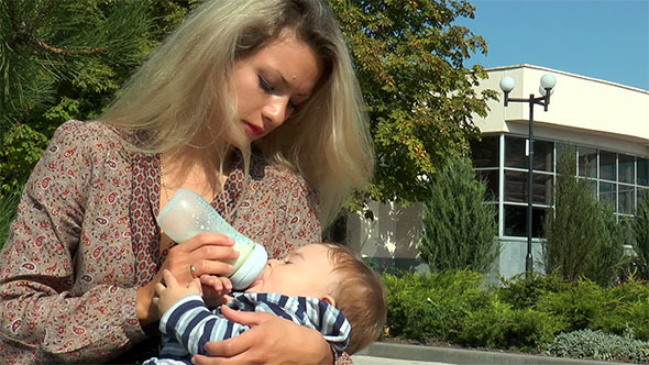 Mother Bottle Feeding Baby