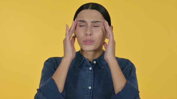 Latin Woman Having Headache Yellow Background