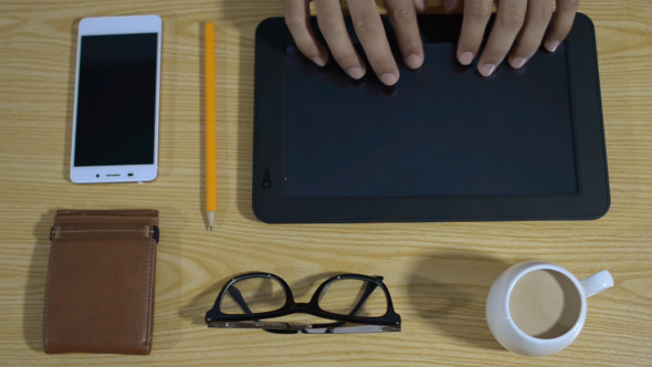 Fast Freelancer Busy with Smartphone and tablet  alt