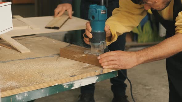 Slow Motion Close Up of Table Saw Cutting Wood on Construction Site