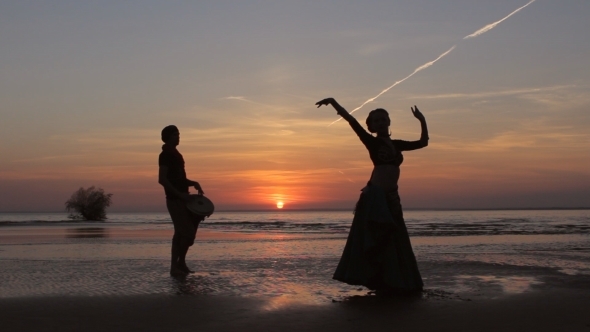 Silhouette Girl Dancing Exotic Dance With Drummer