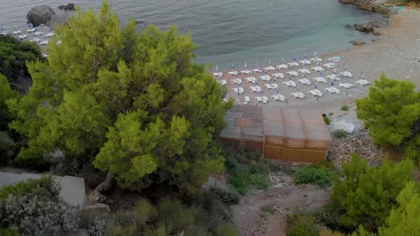 Aerial Drone Revealing Footage of Adriatic Sea empty beach with look from a birds eye view.