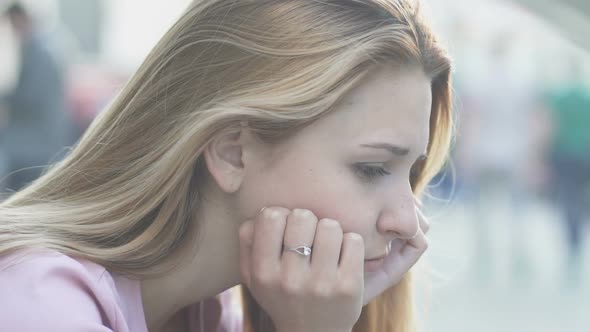 Wind Playing With Hair of Sad Girl Lonely Seating on Street, Breakup Depression