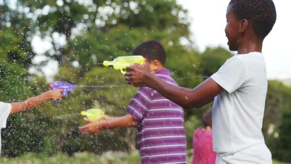 Group of kids playing with water gun