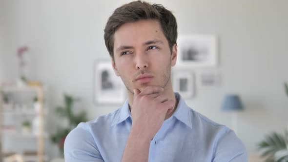 Portrait of Thinking Handsome Young Man Got New Idea