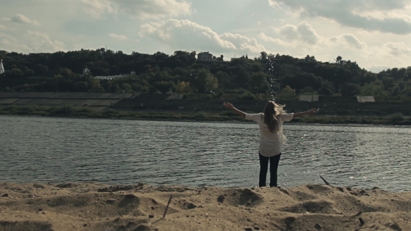 She Runs To The Water On a Sandy Beach