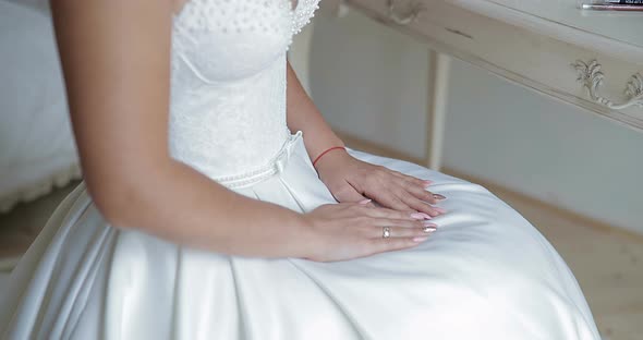 Bride Sits in Front of the Mirror