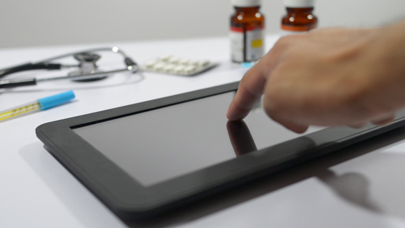 Doctor Using Tablet