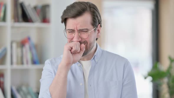 Portrait of Sick Man in Glasses Coughing