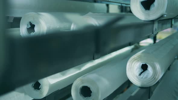 Close Up Shot of Vertical Paper Roll Conveyor