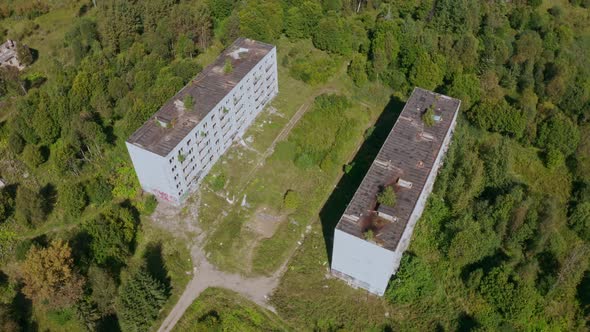 Aerial View of Abandoned and Destroyed Buildings From the Times of the USSR in a Green Picturesque