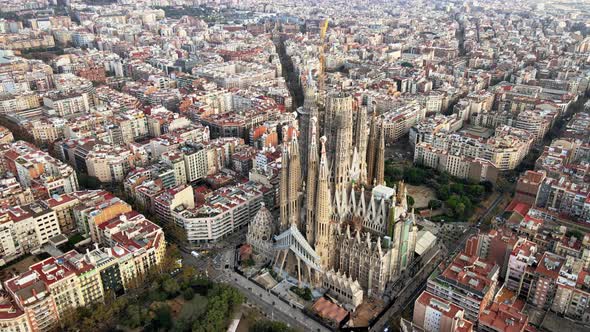 Aerial drone view of Barcelona, Spain. Blocks with multiple residential buildings and Sagrada Famili