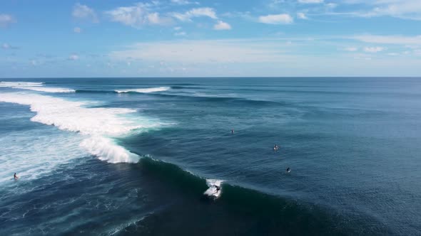 Surfer catch the wave aerial footage