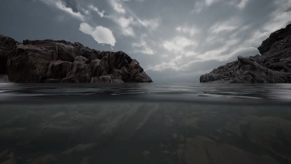 Half Underwater in Northern Sea with Rocks