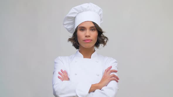 Smiling Female Chef in Toque