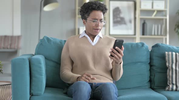 Young African Girl Get Stressed While Scrolling The Phone