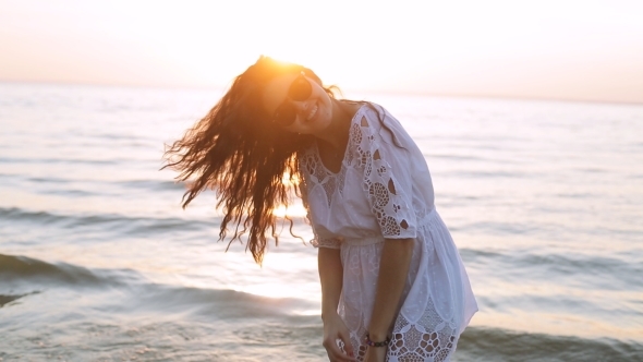 Beautiful Girl Posing And Smiling At Sunset