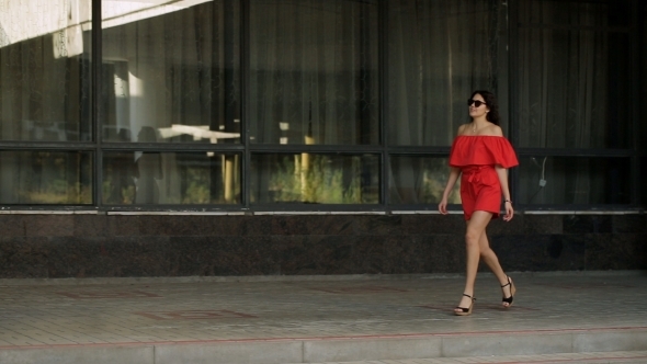 Beautiful Girl Walking On The Street