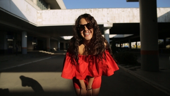 Girl In a Beautiful Dress Smiling At The Camera