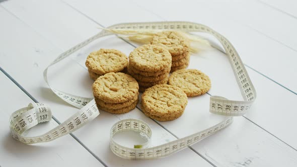 Healthy Oatmeal Cookies on White Wood Background, Side View.