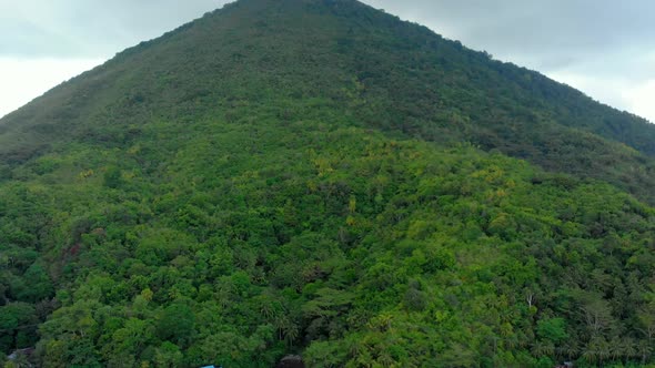 Aerial: flying over Banda Islands active volcano Gunung Api Indonesia