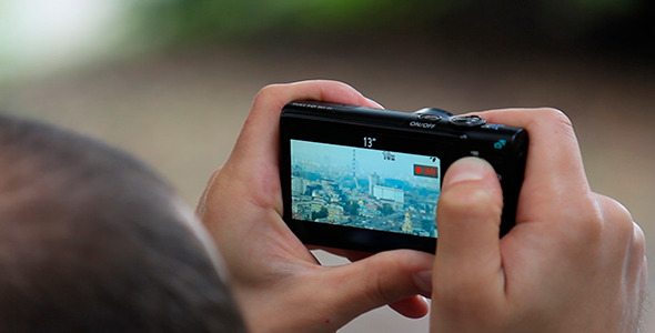 Man Photographing City