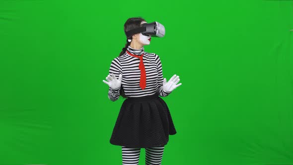 Mime Girl Is Using a Virtual Reality Glasses. Chroma Key.