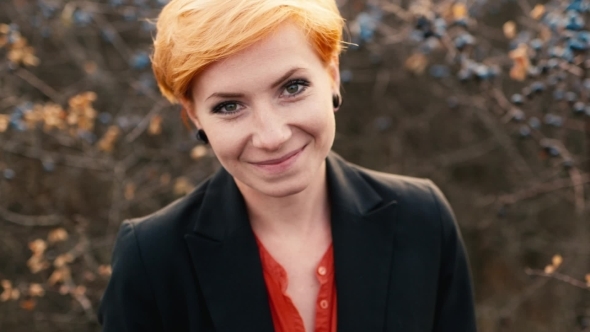 The Red-haired Model Posing In Camera