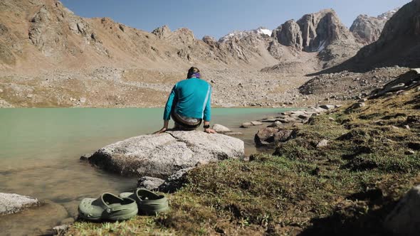 Hiker Man Rest at Mountain Lake