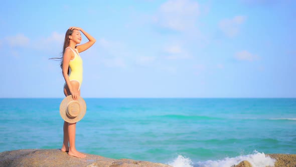 Asian woman enjoy around beautiful beach sea ocean